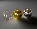 A Picture of a glass-, gold-, and chrome ball, created in 3ds Max